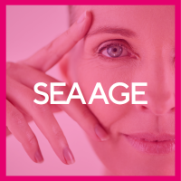 A bright pink background with the word SEA AGE across a close up of a beautiful older woman's blue eye